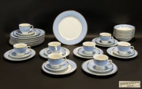 Royal Doulton Part Service Bruce Oldfied 2004 in white ground with blue edging and gilt trim. In