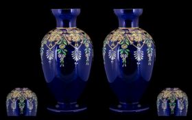 A Pair of Crystal Blue Bohemian Style Glass Vases in enamelled floral decoration throughout. Small