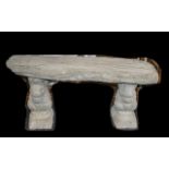 Timber Seat - A large straight timber seat on squirrel plinths.