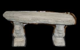 Timber Seat - A large straight timber seat on squirrel plinths.