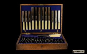 Early 20thC oak Cased Cutlery Box containing 6 dessert knives and forks, six dinner knives and