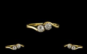 18ct Gold - Attractive Two Stone Diamond Set Twist Ring. The cushion cut diamonds of excellent