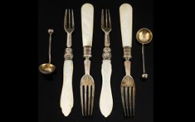 Four Mother of Pearl Handled Silver Forks together with two silver salt spoon. Mixed dates.