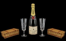 A 20thC Champagne Gift Set comprising of a bottle of Moet and Chandon, two champagne flutes. In a