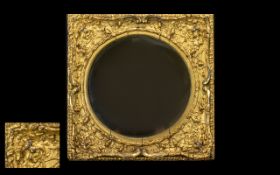 An 18th/19th Century Gilt Wood and Gesso Wall Mirror of square molded form with grotesque mask