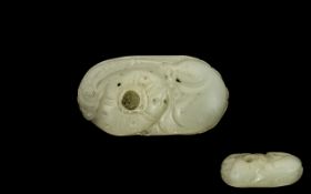 A Chinese Carved Mutton Fat Jade Pebble