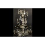 A French Six Branch Chandelier Light Fitting with iron arms and crystal droplets.