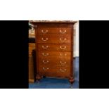 A Grange French Cherry Wood Tall Chest with 6 drawers, brass handles and casters.