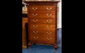 A Grange French Cherry Wood Tall Chest with 6 drawers, brass handles and casters.