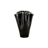 A Large Black Glass Handkerchief Vase finished in a high gloss sheen and measuring 21 inches in