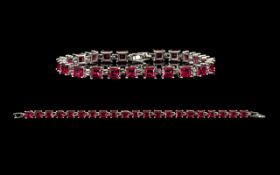 Ruby Tennis Bracelet, 21 Princess cut rubies of rich, glowing red, each measuring just over 1ct,