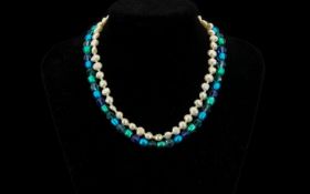 Freshwater Pearl Necklace, together with a blue beaded necklace. Freshwater Pearls separated with