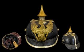 Antique German Pickelhaube with a winged eagle motif inscribed 'Mit Gott Fúr Koenig Und Vaterland'