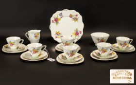 Art Deco Style Part Teaset comprising a sandwich/cake plate, a sugar bowl, milk jug and six cups,