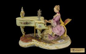 Capo-di-Monte Fine Quality Hand Painted Figure ' Lady Playing a Piano ' In 18th Century Dress.