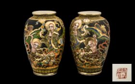 A Pair of Early 20th Japanese Satsuma Vases in Painted Ceramic decoration. 15 inches in height.