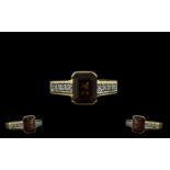 18ct Gold Garnet and Diamond Set Ring of Attractive Form. The Central Emerald Cut Garnets of Good