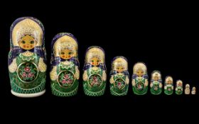 Matryoshka Russian Nesting Dolls. Handpainted set of ten in the iconic Semionov style. Date 1992.