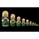 Matryoshka Russian Nesting Dolls. Handpainted set of ten in the iconic Semionov style. Date 1992.
