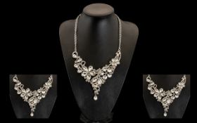 Clear Austrian Crystal Bib Necklace, an asymmetric Y shaped, articulated 'bib' set with a variety of