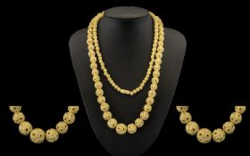 A Carved Bone Graduated Bead Necklace, early 20thC and beads ranging from 6 mm to 14 mm. The