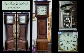 A 19thC Oak Cased 30 Hour Long Case Clock with a painted dial and Roman Numerals.