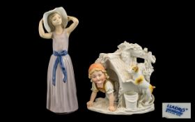 Lladro Figurine model no 5011, 'Trying On A Straw Hat' measuring 12 inches in height.