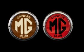 MG Owners Club Badge with chrome outer trim and black MG Owners Club on red ground.