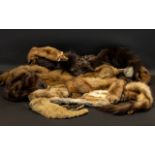 A Collection of Furs to include a ranch piece dark brown mink hat, various other fur hats,
