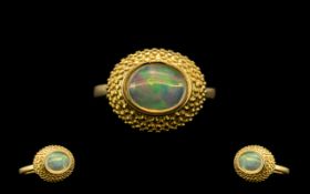 Opal Solitaire Ring, a 1.5ct oval cut, natural opal cabochon, mined in Ethiopia, displaying the full