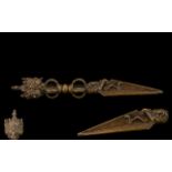 Tibetan Bronze Phurba The triform blade clasped by a dragon head,