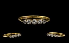 18ct Gold and Platinum 5 Stone Diamond Ring - Gallery setting marked 18ct and Platinum.
