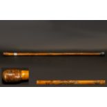 Walking Cane bamboo effect with decorative animal engravings and a rubber ferrule on the end.