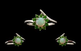 Opal and Russian Diopside Halo Ring, a round cut. natural opal of .75ct framed with .5ct of round