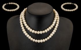 Single Strand of Fresh Water Pearls length 32 inches. Together with a matching bracelet.