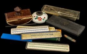 Collection of Vintage Writing Equipment to include a box of proctractors, a collection of rulers,