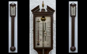 An Edwardian Mahogany Stick Barometer unmarked silvered dial.