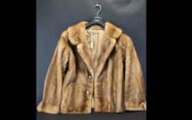 Blond Mink Jacket with collar and reveres, with hook and eye fastening and two side slit pockets.