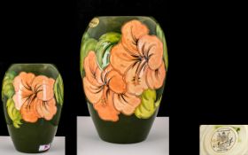 William Moorcroft Signed Tubelined Vase. Mid-late 1950's. Coral Hibiscus On Green Ground.