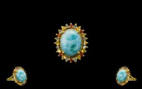 Larimar and Green, Yellow and Sunset Sapphire Ring, a 10ct cabochon of the natural, opaque,