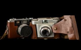 Two Vintage Cameras including Franka camera in tan leather case and shoulder strap;