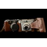 Two Vintage Cameras including Franka camera in tan leather case and shoulder strap;