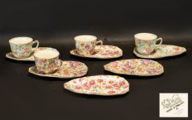 A Set of Four Royal Winton Grimwades Chintz Tea Cup and Tennis Tray Sets.