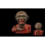 Jolly Bank 'Little Joe' cast iron savings bank depicting a smiling boy holding out his hand for a