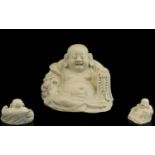 Chinese Sitting Buddha. Antique Chinese Buddha in off white porcelain, age related crazing, 5 inches