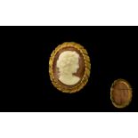 Cameo Brooch in Gold Coloured Metal - oval cameo brooch in gold coloured mount, 2'' x 1.75''. Please