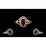 18ct Gold Oval Shaped Diamond and Ruby Set Cluster Ring - of attractive form.