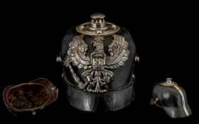 WWI German Pickelhaube with winged eagle motif inscribed 'Mit Gott Fúr Koenig Und Vaterland' beside