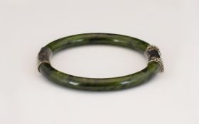 A Hard Stone Jadeite hinged Bangle with