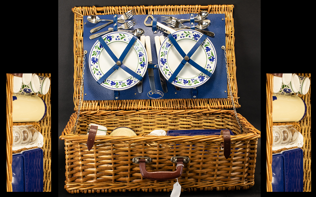 A Wicker Picnic Hamper with four place s